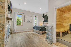 Oversized Master bedroom with smart TV, fireplace, and sauna!