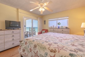 Gulf front master bedroom with a king size bed.