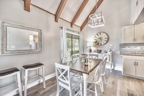 The 2 story vaulted dining area comfortable seats 6 and opens to nature and golf course views through one of the double sliding glass doors.
