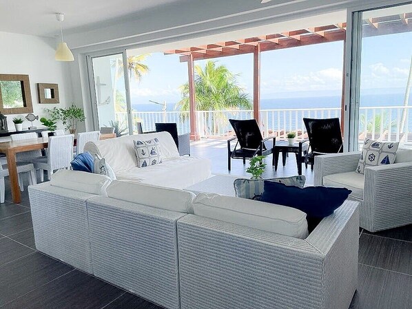 Relax in style and comfort in our spacious living room, which features comfortable seating for up to six guests. Take in the stunning ocean view from the huge balcony, which is just steps away.