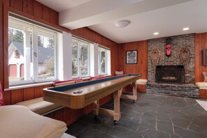 LR (1st Floor) - shuffleboard, darts, fireplace, futon, TV, full game closet