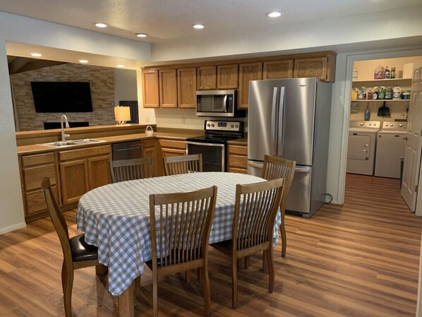 Spacious eat-in kitchen. Perfect for cooking and entertaining. Table sits six. Meals together and family game night!