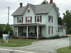 Front of the house with new driveway and brick walkway