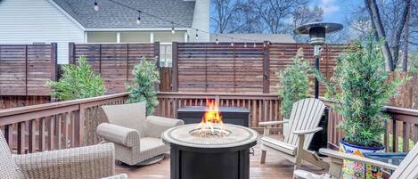 Seating area around the fire and under the string lights