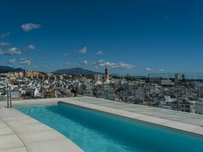 Sky, Cloud, Water, Building, Blue, Azure, Swimming Pool, Plant, Body Of Water, Coastal And Oceanic Landforms