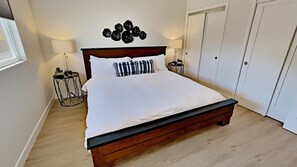 Master Bedroom with King Bed, Ceiling Fan, and TV