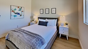 3rd Bedroom Queen Bed, Closet, Ceiling Fan, looks out to backyard with Canyon view