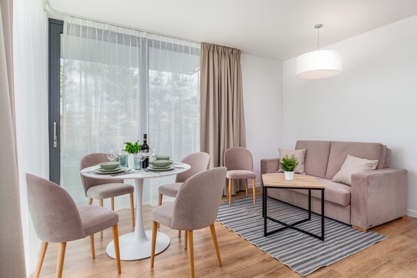 Relax in the stylish living area with a comfortable sofa and modern decor.
