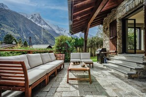 Terrace with lounge seating & BBQ  