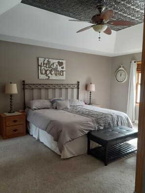 Main floor king size bed with connecting bathroom