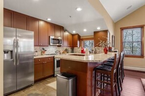 Kitchen with granite countertops and breakfast bar