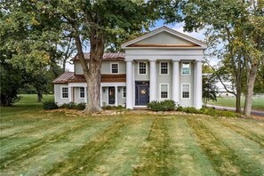 Front of home- two front porches. Each with nooks/seats to read a book or chat