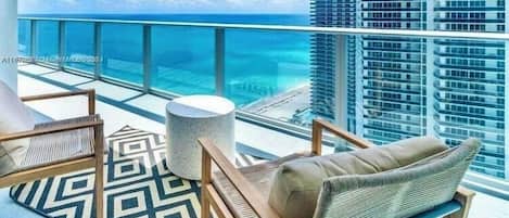 Large size glass balcony with swinging. Hammock chair