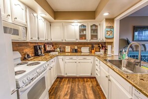 Kitchen is stocked with everything you need to cook your own meals.
