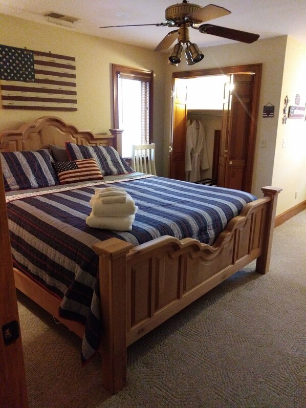 Americana in red, white and blue. King mattress for a good rest. Bath in hallway