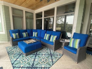 Relax on our rear porch overlooking the pool & back yard.  Plenty of seating!