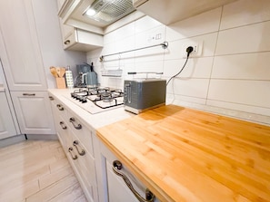 The Kitchen, includes all small appliances and utensils.
