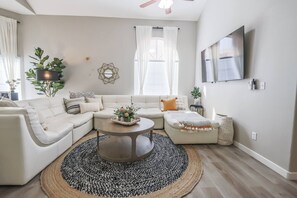 leather sectional couch with plenty of throw blankets