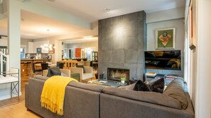 Main Floor - Living Room with Wood Burning Fireplace.