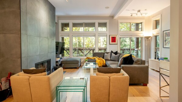 Main Floor - Living Room with Wood Burning Fireplace.
