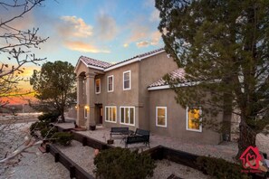 Sandia Sunsets sits majestically on an acre corner block
