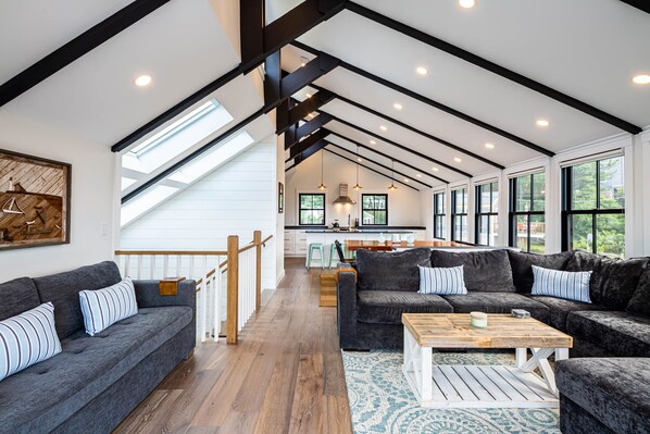 Sweeping views of the living room, dining room and kitchen 