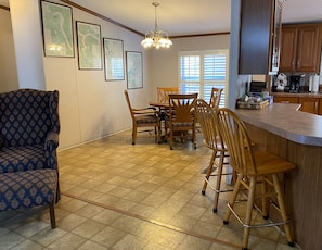 Additional dining area with seating for 6 (4 chairs and 2 counter stools)