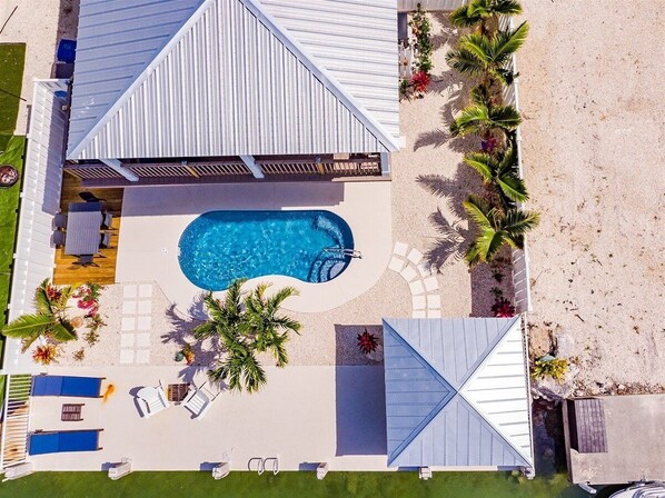 Aerial view of this 3 bed/2 bath private pool home.