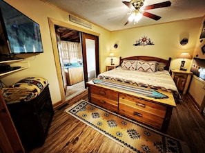 KING size bed with TV/electric fireplace w/easy access to deck w/hot tub