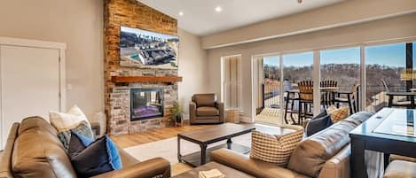 A large TV, an electric fireplace, & a view of the lake! Who could ask for more?