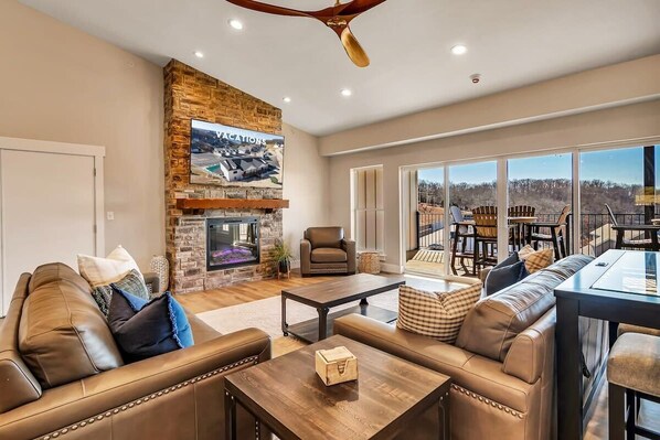 A large TV, an electric fireplace, & a view of the lake! Who could ask for more?