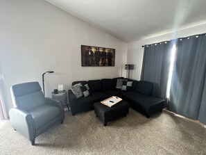 Comfortable sectional couch and recliner.  Throws and pillows are provided.