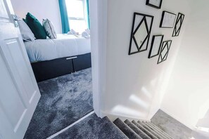 Stairs to the upstairs rooms.