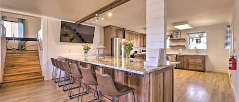 Huge kitchen and bar seating for 14 with 65" Smart TV