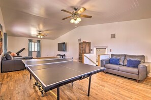 Ping Pong and 75" smart TV and sound bar in comfortable, spacious family room