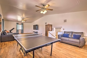 Ping Pong and 75" smart TV and sound bar in comfortable, spacious family room