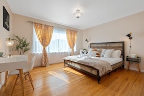 Spacious upstairs bedroom (1) with a king bed.