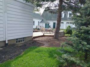 Side yard with view of back deck