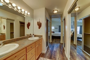 Master bathroom with tons of closet space with his and hers sinks!