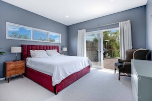 Master bedroom with King size bed. Listen to the ocean at night time.
