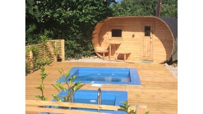 wellness area with log cabin sauna, hot tub and plunge pool and sun loungers