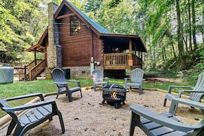 Firepit with chairs in backyard 