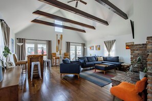 Spacious living room, bar, cocktail table, natural light, tons of comfy seating.