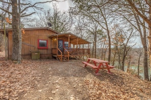 Each cabin has their own fire pit, deck, grill, and outdoor dining table. 