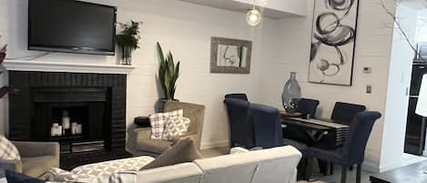 Living Room and Dining Room combo. 18' ceilings add to the open feel.