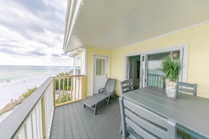 Oversized Balcony overlooking the gulf- Large 4 top table with Lounge chair