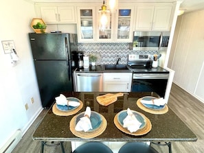 Renovated kitchen with seating for four (new stainless fridge installed since pic taken)