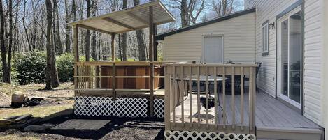 Backyard has a firepit, covered hottub and room to enjoy the outdoor space