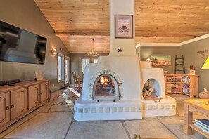 Living Room | Double-Sided Adobe Fireplace (Firewood Provided)