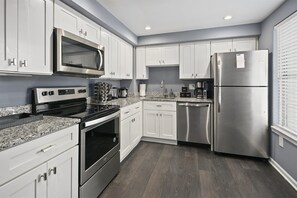 Functional kitchen with an electric range & dishwasher